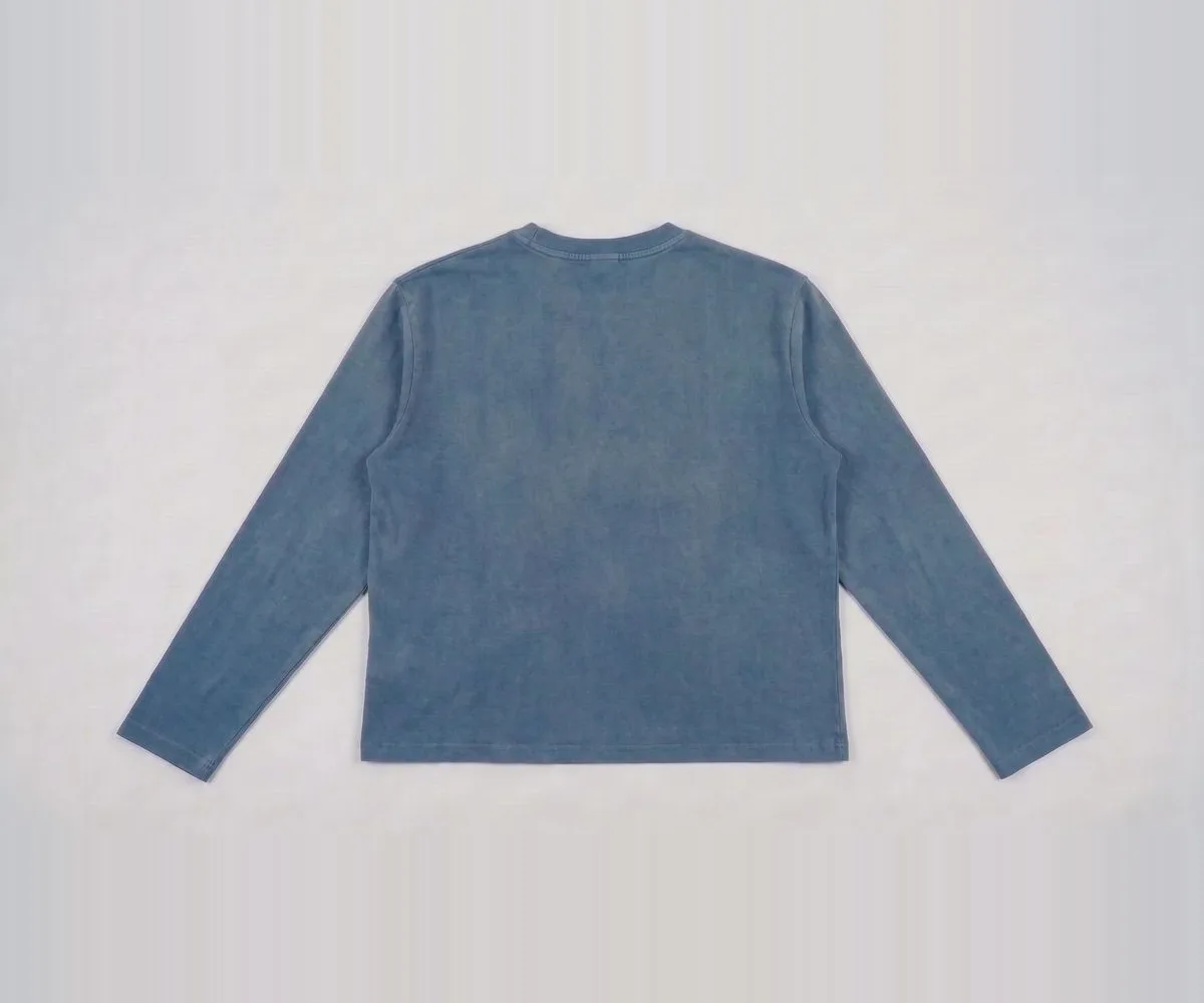 Back view of the plain dusty blue longsleeve